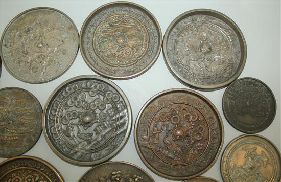 A large collection of Japanese bronze hand mirrors, 19th century, 7.6cm